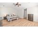 Spacious bedroom features a ceiling fan, a large bed, and side tables for plenty of storage at 2635 Asher View Ct, Raleigh, NC 27606