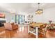 Bright open-concept living room featuring hardwood floors, fireplace, modern lighting, and stylish furnishings at 2635 Asher View Ct, Raleigh, NC 27606