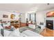 Inviting living room with fireplace, hardwood floors, stylish furniture, and decor with abundant natural light at 2635 Asher View Ct, Raleigh, NC 27606