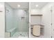 Sleek glass shower with built-in bench, modern shower head, and a convenient built-in vanity at 2635 Asher View Ct, Raleigh, NC 27606