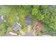 Aerial view of the home showing the surrounding neighborhood and mature trees at 2709 Banks Lake Ct, Fuquay Varina, NC 27526