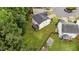 Aerial view of the backyard with a screened-in porch and large grassy area at 2709 Banks Lake Ct, Fuquay Varina, NC 27526