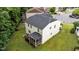 Aerial view of the backyard featuring a screened-in porch and open yard at 2709 Banks Lake Ct, Fuquay Varina, NC 27526