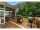 Back deck with screened in porch and two grills for outdoor cooking and entertaining at 2709 Banks Lake Ct, Fuquay Varina, NC 27526