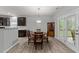 Cozy dining area next to the kitchen features hardwood floors, views to backyard, and an eat-in table at 2709 Banks Lake Ct, Fuquay Varina, NC 27526