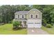 Charming two-story home with a two-car garage and beautifully landscaped front yard at 2709 Banks Lake Ct, Fuquay Varina, NC 27526