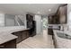 Modern kitchen with granite countertops, stainless steel appliances, dark wood cabinets and open to other rooms at 2709 Banks Lake Ct, Fuquay Varina, NC 27526