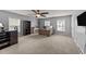 Office space with ample desk space, shelving, and lots of natural light from two windows at 2709 Banks Lake Ct, Fuquay Varina, NC 27526