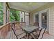 Screened-in porch with ceiling fan and outdoor dining set for relaxing or entertaining at 2709 Banks Lake Ct, Fuquay Varina, NC 27526