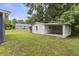 Spacious backyard showcasing a large, detached garage with ample parking and storage space at 2752 Weldon Ter, Durham, NC 27703