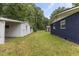 Backyard with garage and greenery, providing lots of space to enjoy outdoors at 2752 Weldon Ter, Durham, NC 27703