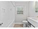 All-white bathroom design, modern fixtures, and natural lighting at 2752 Weldon Ter, Durham, NC 27703