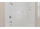 Modern bathroom features a white tiled shower with a built-in niche and brushed silver hardware at 2752 Weldon Ter, Durham, NC 27703