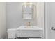 Bright bathroom with a white vanity, gold hardware, and a framed rectangular mirror at 2752 Weldon Ter, Durham, NC 27703