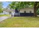 Charming home featuring a covered entrance, dark brick accents and a well maintained lawn at 2752 Weldon Ter, Durham, NC 27703