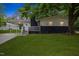 Charming home featuring a covered entrance, dark brick accents and a well maintained lawn at 2752 Weldon Ter, Durham, NC 27703