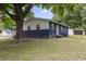 A home with a white porch, a detached garage, and a beautiful, green yard for outdoor enjoyment at 2752 Weldon Ter, Durham, NC 27703