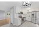 Modern kitchen with white cabinets, stainless steel appliances, and stylish countertops at 2752 Weldon Ter, Durham, NC 27703