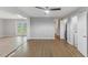Open living room with hardwood floors, gray walls, and views to the outdoor space at 2752 Weldon Ter, Durham, NC 27703