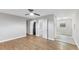 Living room featuring neutral gray walls, hardwood floors, and laundry closet access at 2752 Weldon Ter, Durham, NC 27703