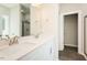 Well-lit bathroom featuring a double sink vanity and a framed mirror at 2807 Ricolden Trl, Elon, NC 27244