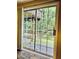 View of the backyard from inside, showing a raised deck and lush greenery at 306 Fincastle Dr, Cary, NC 27513