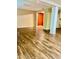 A large basement area with luxury vinyl plank floors and a pillar holding up the ceiling at 306 Fincastle Dr, Cary, NC 27513