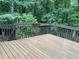 Wooden deck surrounded by a lush green forest and a serene landscape at 306 Fincastle Dr, Cary, NC 27513