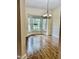 Bright dining area showcases wood floors, a bay window, and an elegant chandelier at 306 Fincastle Dr, Cary, NC 27513