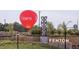 A majestic hot air balloon floats over the Fenton entrance sign at 306 Fincastle Dr, Cary, NC 27513
