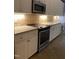 Bright kitchen showcasing a stainless steel oven, decorative backsplash, and granite countertops at 306 Fincastle Dr, Cary, NC 27513