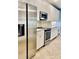 Kitchen with stainless steel refrigerator, oven, and microwave, offering modern convenience at 306 Fincastle Dr, Cary, NC 27513