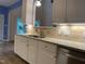 Kitchen view featuring stainless steel sink, granite countertops, and decorative backsplash at 306 Fincastle Dr, Cary, NC 27513
