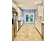 Spacious kitchen with view to the patio through double doors, stainless appliances, and ample counter space at 306 Fincastle Dr, Cary, NC 27513