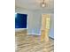 A large living room showcases luxury vinyl plank floors and three separate entryways into other rooms at 306 Fincastle Dr, Cary, NC 27513