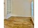 Bright living room featuring stylish wood floors and built-in bookshelves at 306 Fincastle Dr, Cary, NC 27513
