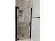 Nicely tiled shower with a glass enclosure, a rainfall shower head, shelving, and bronze fixtures at 306 Fincastle Dr, Cary, NC 27513