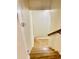 Staircase leading to the lower level with a view of herringbone-style luxury vinyl plank flooring at 306 Fincastle Dr, Cary, NC 27513