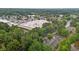 Apartment building surrounded by greenery near commercial area, offering convenient urban living at 3077 Huntleigh Dr, Raleigh, NC 27604