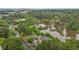 Serene community next to a tranquil lake, surrounded by lush trees and convenient parking at 3077 Huntleigh Dr, Raleigh, NC 27604
