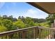 Balcony view of green trees and blue sky at 3077 Huntleigh Dr, Raleigh, NC 27604