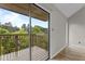 Balcony offers a beautiful view of the surrounding trees, providing a peaceful outdoor retreat at 3077 Huntleigh Dr, Raleigh, NC 27604