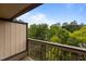 Balcony view of lush green trees and blue sky at 3077 Huntleigh Dr, Raleigh, NC 27604