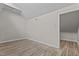 Bedroom with light wood-look floors and neutral walls at 3077 Huntleigh Dr, Raleigh, NC 27604