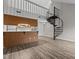 The interior features a spiral staircase and a well-maintained kitchen setup, offering a cohesive living space at 3077 Huntleigh Dr, Raleigh, NC 27604