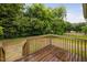 View of a wooden deck overlooks the lush backyard of this home at 325 Martin Luther King Jr Blvd, Raleigh, NC 27601