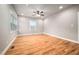Spacious room with hardwood floors, modern lighting, and natural light from the windows at 325 Martin Luther King Jr Blvd, Raleigh, NC 27601