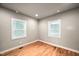 Sun-filled bedroom with hardwood floors and large window at 325 Martin Luther King Jr Blvd, Raleigh, NC 27601