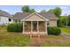 Charming bungalow with a welcoming front porch and beautiful landscaping at 325 Martin Luther King Jr Blvd, Raleigh, NC 27601