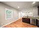 Open concept kitchen with stainless steel appliances, wood floors, and granite countertops at 325 Martin Luther King Jr Blvd, Raleigh, NC 27601